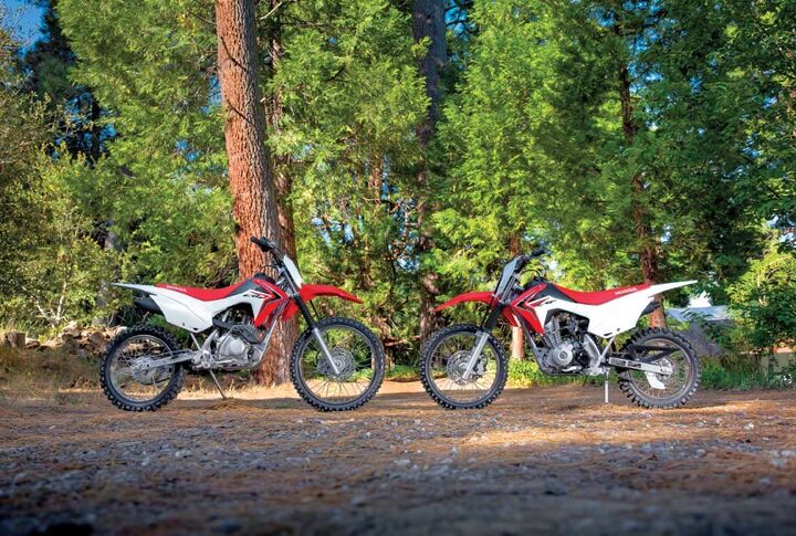 2014 honda crf125f and crf125f big wheel review, Honda s newest CRF trail bikes the CRF125F right and CRF125F Big Wheel replace the CRF80F and CRF100F in the company s lineup but keep the same seat height