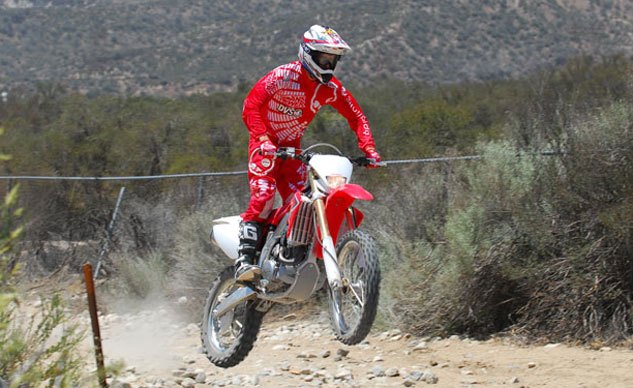 2013 honda crf450x review, Honda s CRF450X embodies the spirit of Open class off road performance with a tractable engine stable chassis and plush controlled suspension