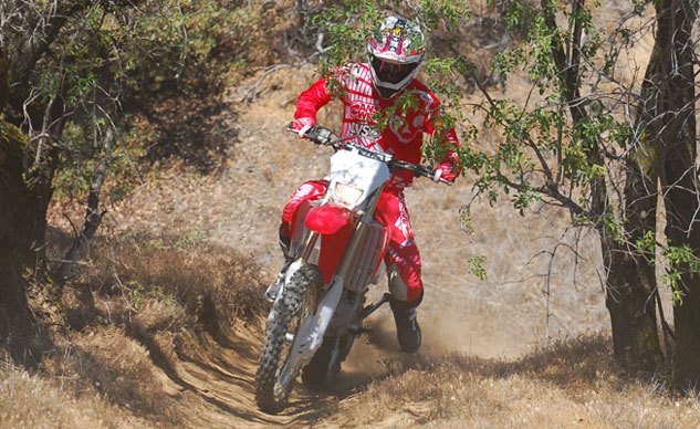 2013 honda crf450x review, Smooth power delivery with plenty of low end grunt and excellent throttle response help the CRF450X grunt out of tight spots with authority