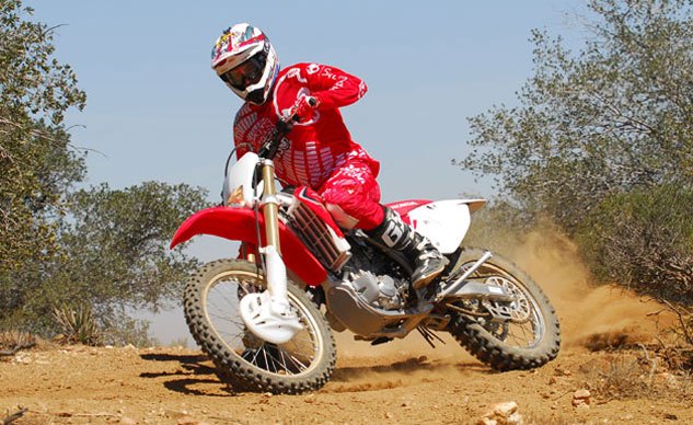 2013 honda crf450x review, An aluminum perimeter chassis helps the 450X feel small but a 269 pound weight and a high cg make its steering slightly heavy especially at low speeds Even so its steering precision and front end feel are very good