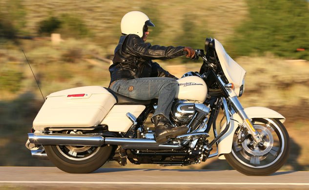 2014 harley davidson touring motorcycles review, The new Street Glide Special is essentially the same bagger but more fully equipped with the larger Boom Box 6 5GT system gloss black inner fairing CVO style adjustable rear shocks and alternate wheels It costs 22 499