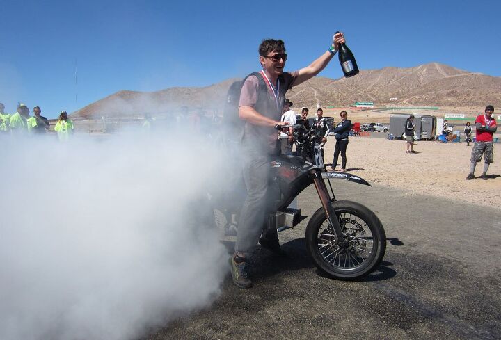 electric boogie into the record books, What better way to celebrate being the first electric motorcycle to finish a 24 hour roadrace than a burnout while holding the champagne