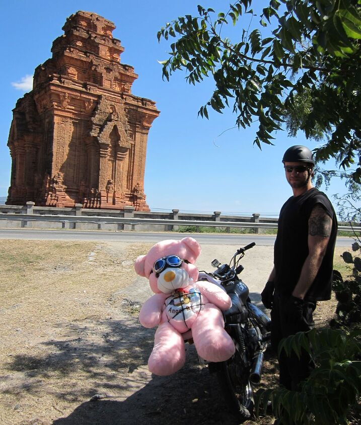 motorcycling in vietnam, Roadside temple and a pink hitchhiker for Mark s lady