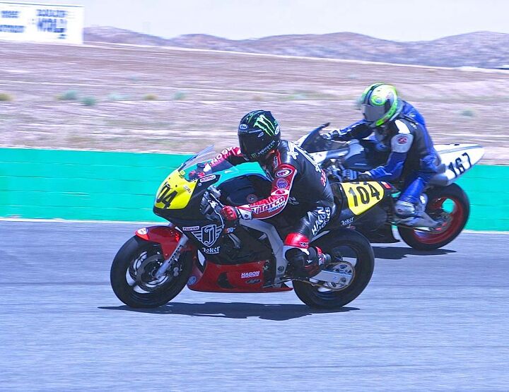 ahrma moto corsa classica, Former National Speedway champ Billy Hamill slips his Suzuki past Xen Stanhope s Ducati on the way to victory in Battle of the Twins Formula 3 Hamill also won the CB160 race and 200 GP