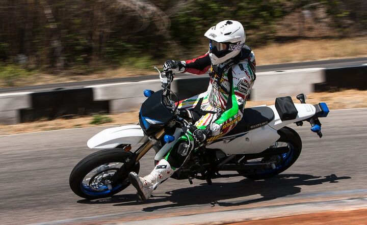 electric vs gas supermoto shootout, Besides its lofty seat height 35 0 in the DR Z400SM is a very unintimidating motorcycle It s enough motorcycle to perform commuter duties and weekend fun rides and it s also fun for a day at the track