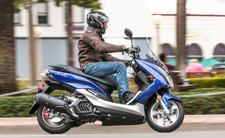 highway hopper scootout, The Yamaha SMAX features the classic scooter step through design while the Honda PCX utilizes the less common step over