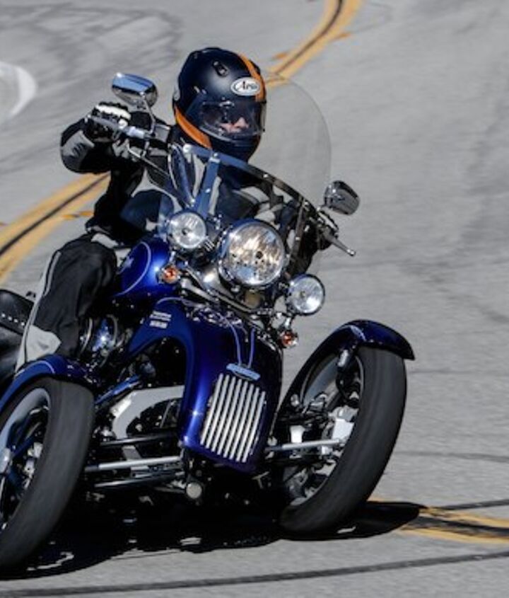 three wheeler threeway, The Trio conversion costs 9 995 plus installation the cost of which is model dependent i e Softail vs Gold Wing etc The Trio s cosmetic grill is from the mind of celebrated motorcycle designer Glynn Kerr Both the nose and fenders are perfectly color matched to the original H D paint