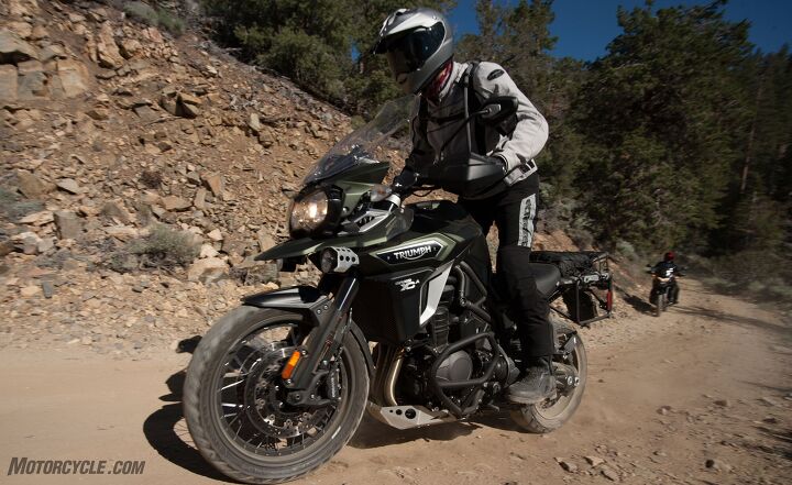 heavyweight adventure touring shootout, This image sums up the whole shootout It must have been staged because the Honda was never this close to the Triumph especially in the dirt Note the airflow I m maintaining between my man bits and Explorer s fuel tank It s hot