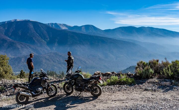 heavyweight adventure touring shootout, An epic view always helps soften the blow when it comes time to tell Burns he s wrong about a motorcycle Actually he did chose the Triumph over the Honda on the ScoreCard but you never know what you re gonna get with that guy
