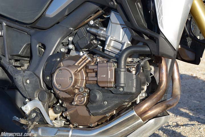 honda africa twin shootout dct vs manual transmission, Note the difference in outward appearance of the DCT cases compared to the manual transmission cases shown above The DCT s clutches are mounted side by side on a shaft in the transmission Each clutch is responsible for meting power to three forward gears
