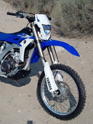 2013 yamaha wr450f review, A fully adjustable 48mm KYB cartridge fork provides 11 8 inches of plush and controlled travel up front The forks are held fast by forged aluminum triple clamps