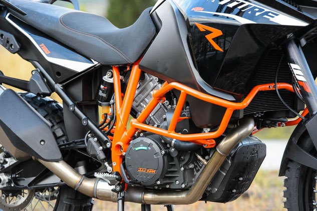 2013 ktm 1190 adventure r review, KTM s 1195cc powerplant is likely the most compact of its class Stout engine guards are standard on the Adventure R A protective skid plate is an optional accessory