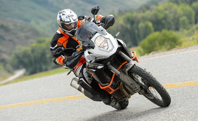 2013 ktm 1190 adventure r review, KTM s Adventure R performs well on the road despite its aftermarket knobby tires Note the standard hand guards Heated grips are an optional accessory