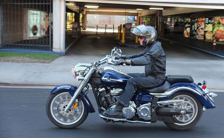 2014 star roadliner s review, The wide saddle pullback handlebars and floating floorboards provide a comfortable rider triangle The heel part of the heel toe shifter is independently adjustable a very nice detail The hidden rear shock gives the Roadliner S a softail appearance