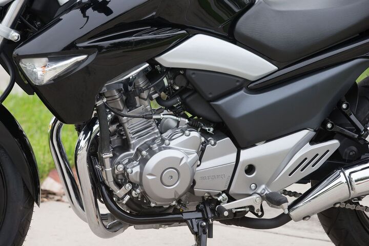 2014 suzuki gw250 review first ride, Mini side fairings hide the radiator for the liquid cooled parallel Twin engine and include integrated turn signal lenses