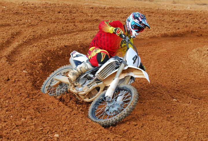 2014 yamaha yz250f review, Monster Mountain s red clay terrain often forms long deep ruts in the corners The light handling YZ had no trouble hunkering down and carving the lines with ease