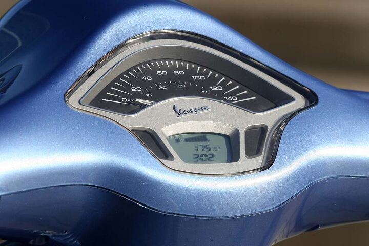 2014 vespa primavera launch in barcelona, An analog speedometer dominates the instrument cluster above a blue backlit LCD screen