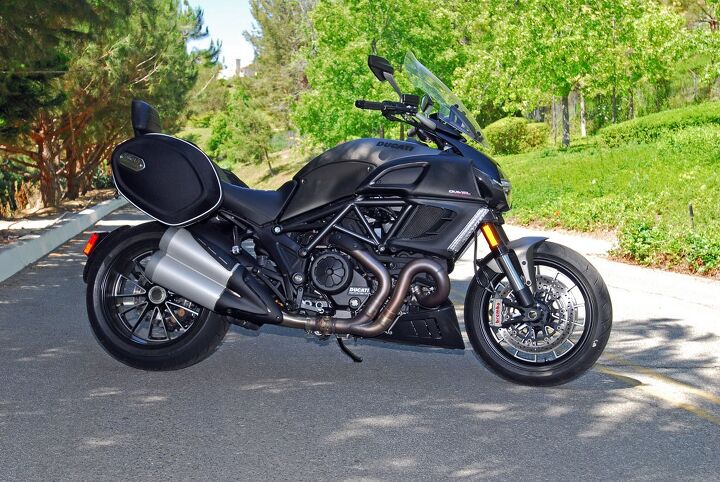 2013 2014 ducati diavel strada review, A windshield detachable saddlebags and a passenger backrest identifies this Diavel as the Strada version