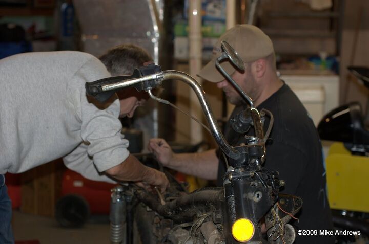 head shake future shock, Kallfelz and Mike Andrews strip an old Honda so they can salvage the frame for a vintage racebike project