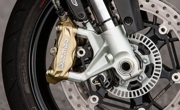 2014 aprilia tuono v4r abs review, New brake calipers and the slotted wheel speed ring identify this as a 2014 version