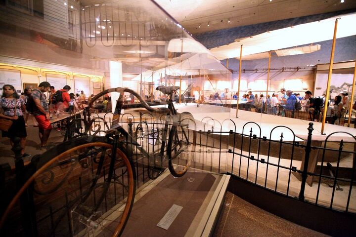 the wings tour 2014 leg one, A Wright Brothers manufactured bicycle sits beside the original Wright Flyer