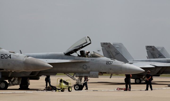 the wings tour 2014 leg two, The pilots of VFA 81 prepare to launch their Super Hornets Navy pilots who fly and ride say the experiences are similar