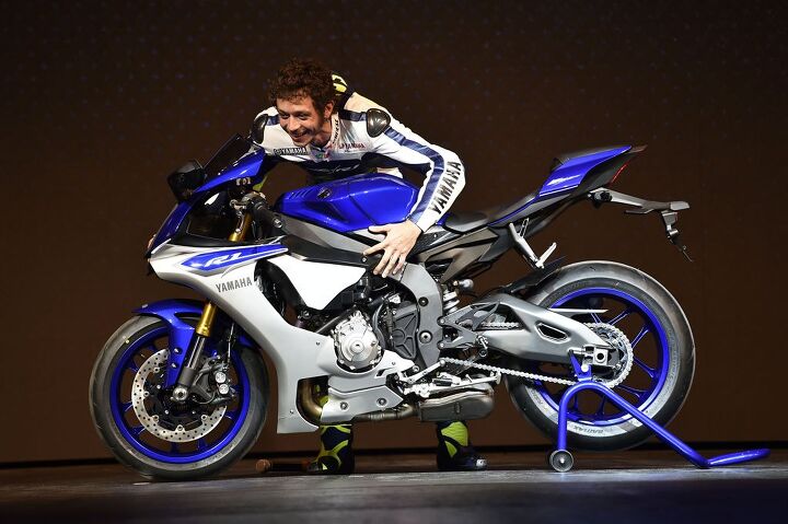 motogp 2014 valencia preview, Valentino Rossi and Jorge Lorenzo took time out of their busy schedules to take part in Yamaha s 2015 R1 launch at EICMA