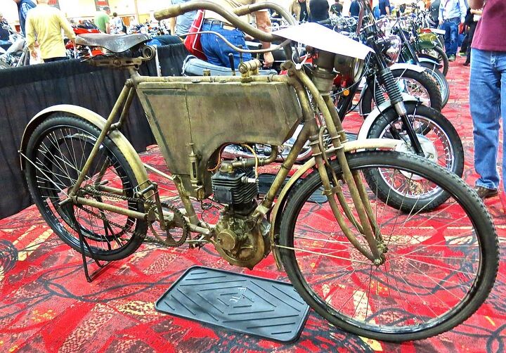 2015 mecum midamerica motorcycle auction, Few in attendance had ever heard of let alone seen a 1903 REX Belt Drive But Englishman Steve Norton knew what it was and that he wanted it and won the bid at 66 000 Not only that he plans to ride the 2 25 horsepower 344cc Single in this year s Cannonball Rally And having served as crew chief for Texans Mike and Buck Carson for two years Norton is aware of the challenge It s a really solid engine he said It will take it He says the engine will tell him what speed it wants to run We ll find the sweet spot maybe 25 to 30 mph He figures they have two chances Either it ll go or it won t British resolve