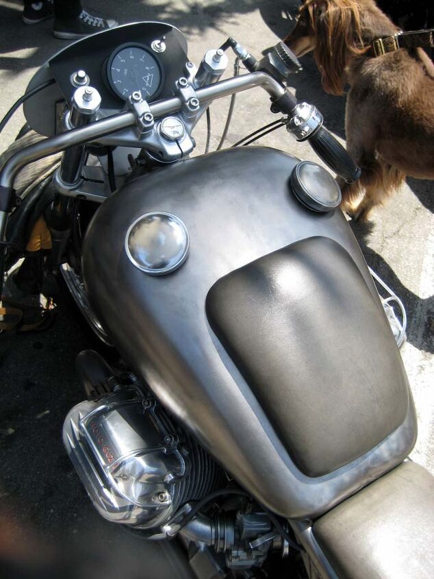 the deus boundless enthusiasm biker build off report, The Guzzi s dual cap gas tank is actually a Harley custom piece Chest pad is magnet held and removable Tach is stock Guzzi unit that David reconfigured and remounted