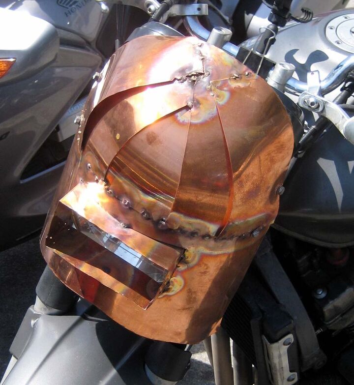 the deus boundless enthusiasm biker build off report, Call it Mad Welder meets Mad Max Nice mix of copper and welding run amuck makes for a unique fairing