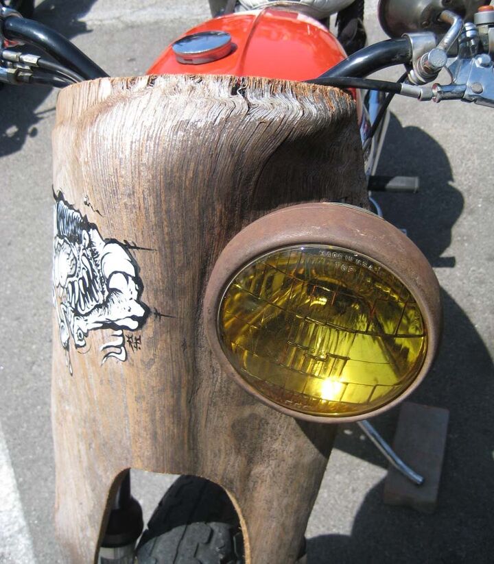 the deus boundless enthusiasm biker build off report, Recycling chunks of old palm trees give vintage Triumph s fairing a rustic tiki party look