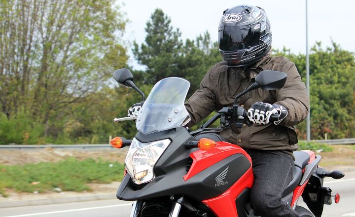 2014 honda nc700x dct abs review, The riding position is comfortably upright giving the pilot a good position for viewing the road ahead The adjustable windshield offers decent protection
