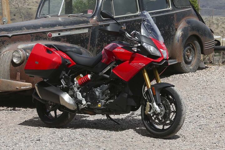 2015 aprilia caponord 1200 abs travel pack review video, Available in Glam White or Formula Red the Caponord 1200 Travel Pack is a quantum leap in technology compared to the things people were getting around in 70 years ago