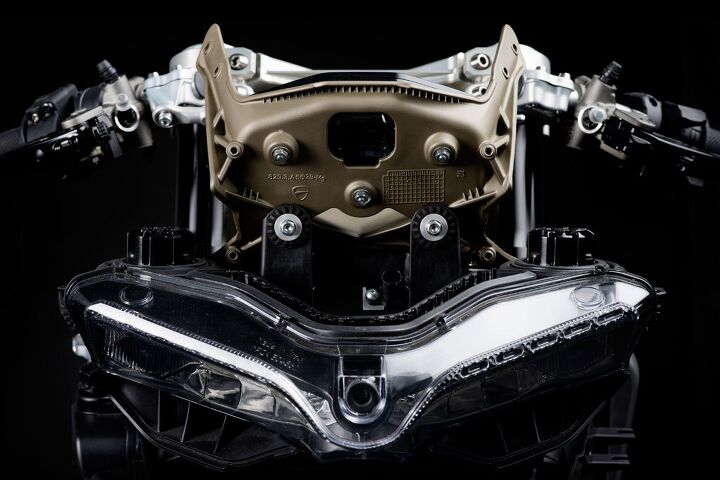 exploring lightweight materials on motorcycles, Ducati s Panigale uses magnesium for its upper fairing bracket a structure that supports the upper fairing headlights and gauges while weighing just 1 3 pounds
