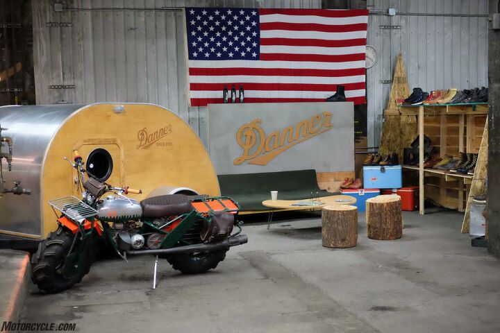 the one motorcycle show 2017 report, Danner Boots brought their shop feel into the vendor area with stumps and a wee trailer Because Portland