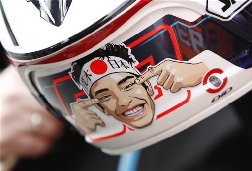 top 10 motorcycle racer helmet graphics, A caricature is seen on the helmet of MotoGP rider Marc Marquez after the qualifying session for the MotoGP Japanese Grand Prix at the Twin Ring Motegi
