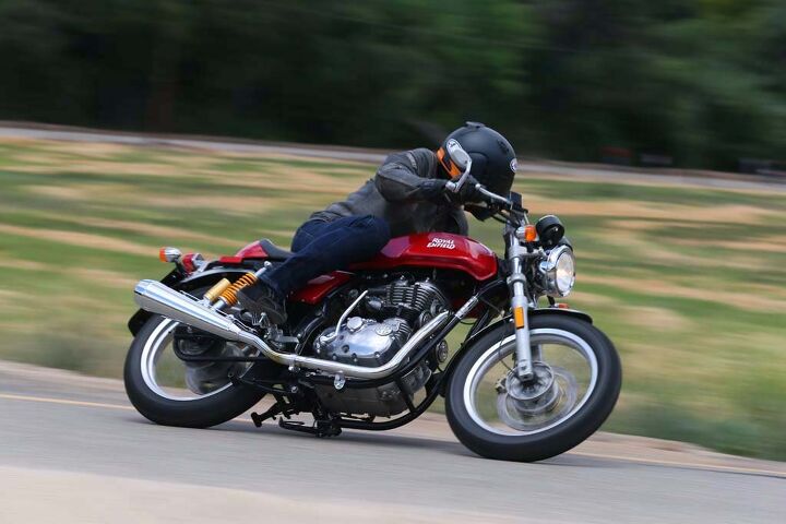 2014 royal enfield continental gt review, Yep the sidestand and its mounting bracket are the first to touch tarmac on the left side and touch down early they do There s more clearance on the right The Contis are designed to be cool urban commuters so Enfield didn t prioritize cornering clearance