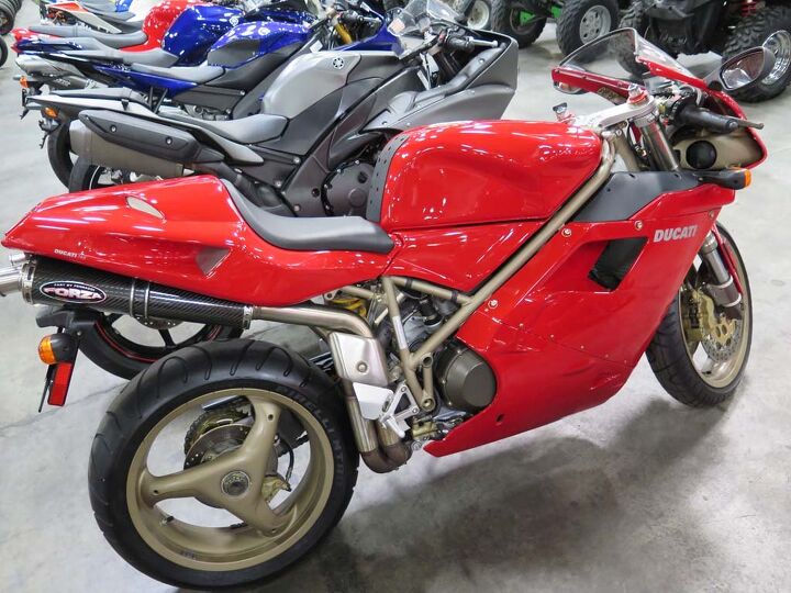 inside a motorcycle auction, Oh yes this was the little lovely we wanted to take home 1998 Ducati 748 with just 169 miles on its perfect little clock The 5100 it sold for was no great bargain in the end