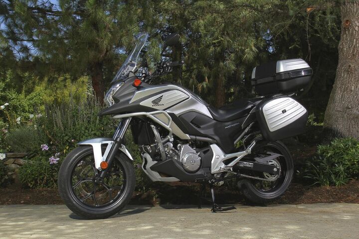 value for money hondas 2014 honda nc700x, Fully accessorized with a tall windscreen and luggage the NC700X goes from a daily commuter to a long distance traveling companion