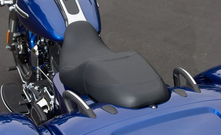 2015 harley davidson freewheeler review, The seat offers good passenger accommodations with integrated grab rails and under the black covers a slip in passenger backrest