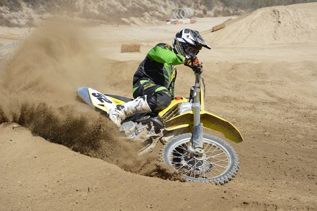 2015 suzuki rm z450 review, Make no mistake the RM Z450 can churn the earth but it is best ridden in the middle of the powerband More low end torque and a broader pull would be welcome additions