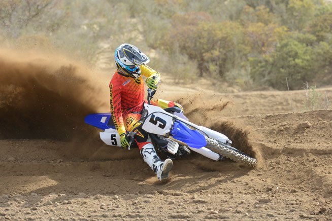 2015 yamaha yz450f review, Cornering feel and precision are greatly improved on the 2015 YZ450F but be careful with the throttle on the exit of the turn It s hard to steer the front wheel when it s in the air