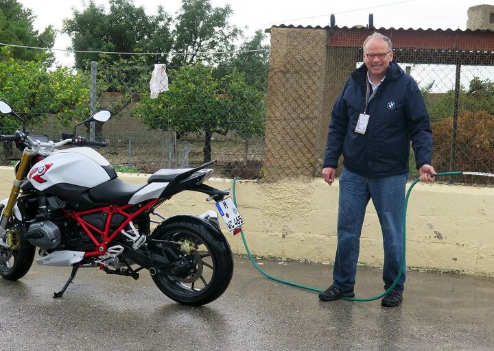 whatever what seems to be our problem, Whatever it takes BMW Pressesprecher Rudi Probst mans the hose at the R1200R introduction last week
