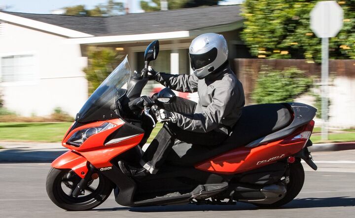2014 kymco downtown 300i review, Turn in is quick on the 300i but it stops well short of being any kind of sporting scooter