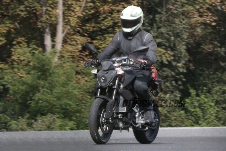 small displacement bmw spied testing, Strip away the testing equipment and you can make out some of the test bike s features including a single headlight upside down fork five spoke alloy wheels and a single front brake disc Expect the production version to add a chin fairing