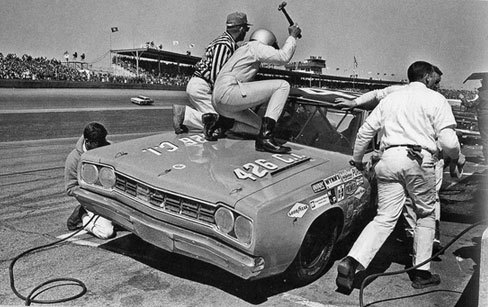top 10 feel good motorcycle events, Kyle Petty s dad fixes a flapping vinyl roof at the 68 Daytona 500