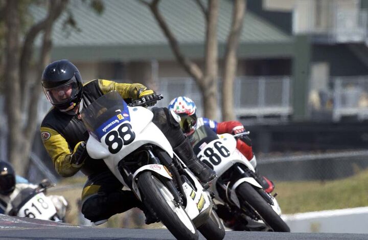 skidmarks slow bikes fast, Jack Walsh a very large and fast man racing his suspiciously fast Honda VTR250 In this photo snapped in Sonoma Raceway s Turn 2 c 2002 he shows off his legendary speed and smoothness Photo by Gary Rather