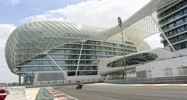 duke s den my tour of racetracks around the world part 4, Okay this isn t a shot of me but it captures the exotic allure of the Yas Marina Circuit as it wraps around the Yas Viceroy Hotel The Panigale launch was the only press intro I ve been able to walk from my hotel room directly into the pit garages