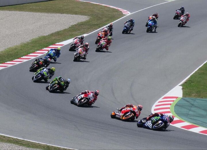 top 10 things at the 2015 catalunya grand prix, First lap MotoGP A lap or two later there was a huge roar from the crowd and no more Marquez next time around A bit later another roar and no more Dovizioso Ducati It s fun to watch a road race in the rustic way hanging on the fence