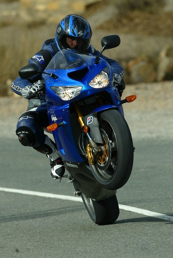 duke s den my favorite wheelie photos, In terms of style points I don t think it gets better than a leaned over and crossed up wheelie This 2005 Kawasaki ZX 6R was shot near the Almeria Circuit in Spain